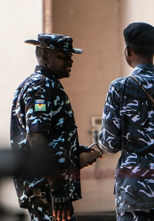 Nigerian security officers in conversation